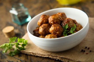 Homemade meatballs in a white bowl