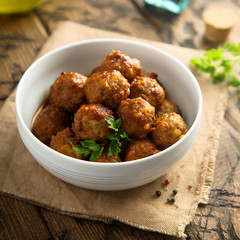 Homemade meatballs in a white bowl
