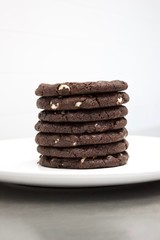 stack of double chocolate cookies on plate
