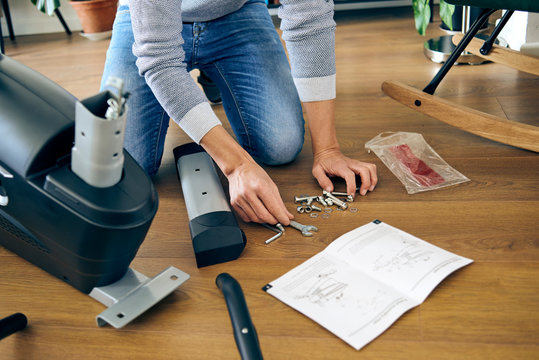 man assembling a stationary bicycle