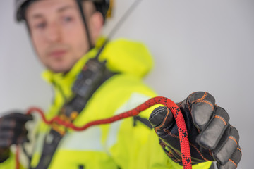 Man in personal protective equipment against falling from a height