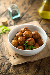 Homemade meatballs in a white bowl