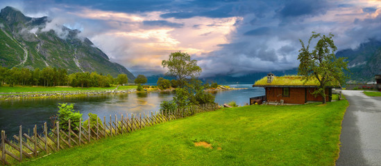 Eidfjord river with fishing hut at sunset. Eidfjord, Norway, Scandinavia