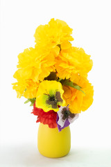Bouquet of beautiful summer flowers in yellow vase.