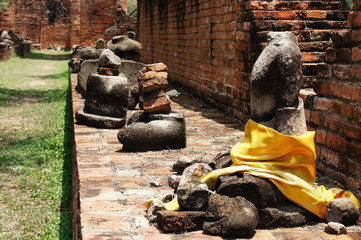Torso statue wrapped in yellow silk cloth