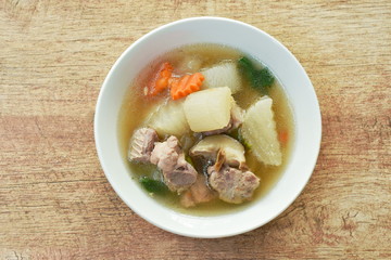 boiled radish with pork bone and mushroom soup on bowl