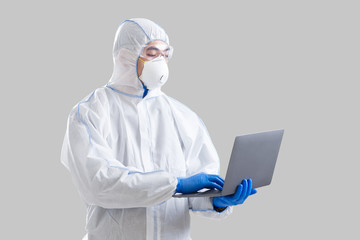 Asian male scientist in protective suit writes information