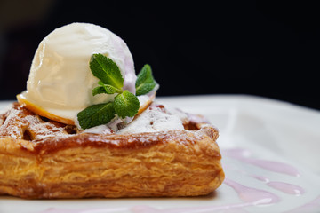 Cake with ice cream on plate.