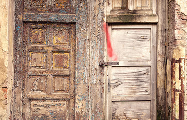 Old brocken grunge wooden doors with peeled paint