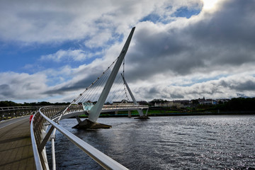 The famous Peace Bridge over Foyle river, located in Derry, Northern Ireland.
