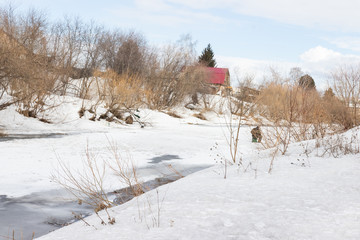 Winter rural river snowy landscape. Forest river in winter snow. Winter Forrest River Peisash