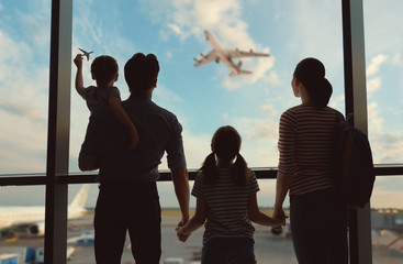 Happy family at the airport.
