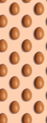 Seamless pattern of chicken eggs on brown background. Food texture