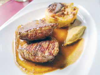 juicy steak beef meat with tomato and potatoes