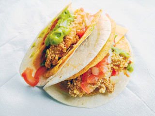 beef tacos served with lettuce and fresh tomatoes