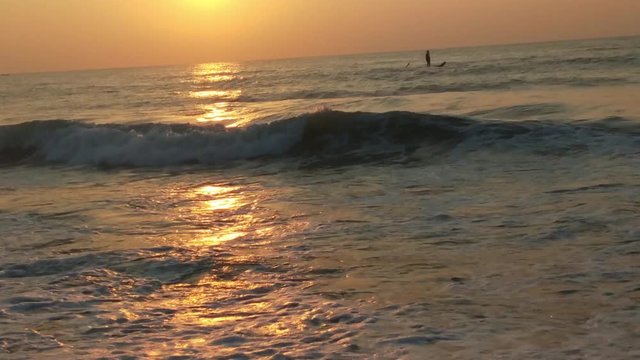 4K Sunrise over tropical island beach and palm trees. Phuket beach sea, View of beach sea on sun light in the summer. Colorful sunset over the beach in the tropical beach sea,the tropical paradise bea