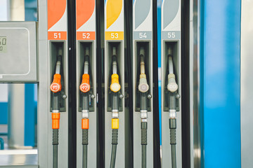 Gas station. Gas pump nozzles on the petrol station.