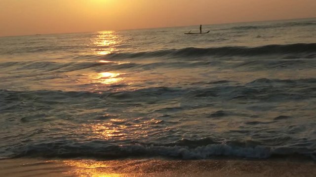 4K Sunrise over tropical island beach and palm trees. Phuket beach sea, View of beach sea on sun light in the summer. Colorful sunset over the beach in the tropical beach sea,the tropical paradise bea
