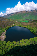 The dark surface of Diamond Lake in Wanaka, New Zealand