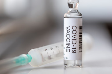 Covid-19 vaccine vial and syringe