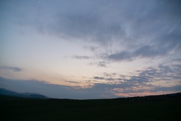 Sunrise or sunset over the hills and meadow. Slovakia
