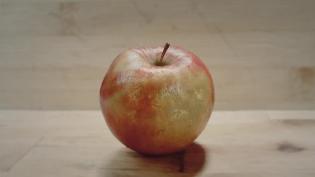 Rotting apple time lapse: a fresh juicy apple turns into an old, rotting apple fruit.