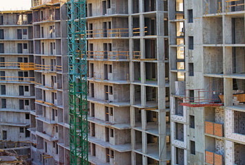 Antivirus (Coronavirus, COVID-19) advertising concept. The process of building new multi-story is stopped. There are no workers on construction site. Quarantine in Kyiv, Ukraine