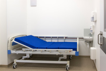 Hospital room. Concept of medicine and illness treatment. Hospital ward with empty hospital bed.