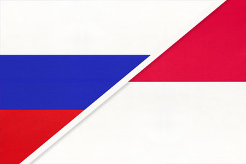Russia vs Monaco national flag from textile. Relationship and partnership between two countries.