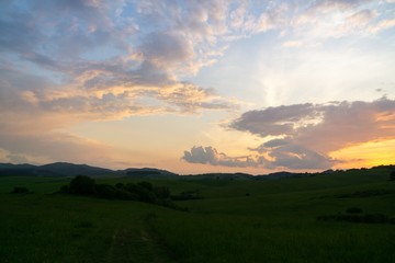 Sunrise or sunset over the hills and meadow. Slovakia