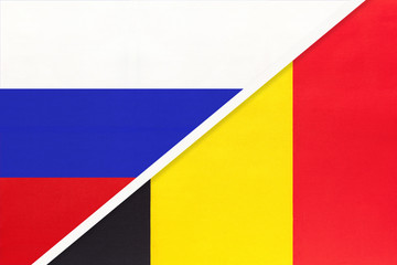 Russia vs Belgium national flag from textile. Relationship and partnership between two countries.