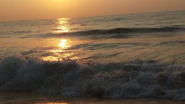 4K Sunrise over tropical island beach and palm trees. Phuket beach sea, View of beach sea on sun light in the summer. Colorful sunset over the beach in the tropical beach sea,the tropical paradise bea