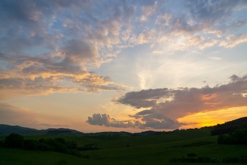 Sunrise or sunset over the hills and meadow. Slovakia