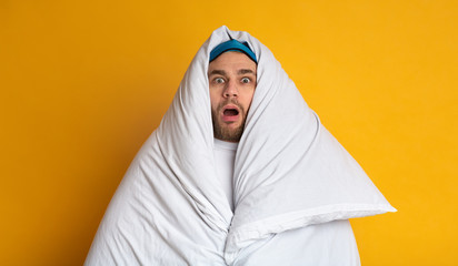 Shocked man in blanket. Stay at home