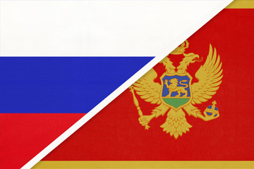 Russia vs Montenegro national flag from textile. Relationship and partnership between two countries.