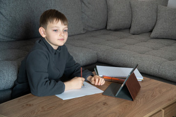 Distance learning online education. Isolated child quarantined at Home in mask distance education and learning. Coronavirus Epidemic. Self isolation, home quarantine. World Crisis COVID-19