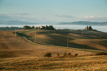 Early foggy morning on Tuscany, countryside, Italy