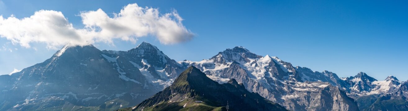 Switzerland, Panoramic view on Eiger, Monch and Jungfraujoch and green Alps around