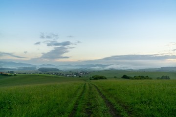 Sunrise or sunset over the hills and meadow. Slovakia