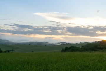 Sunrise or sunset over the hills and meadow. Slovakia