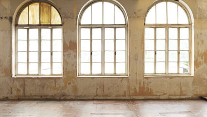 Industrial vintage interior with bright light coming through windows. - Image