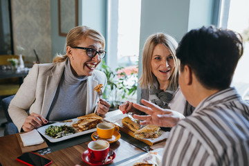 women friends on lunch together
