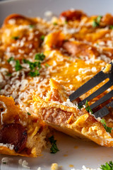 Eating fresh omelette