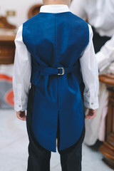boy in blue waistcoat