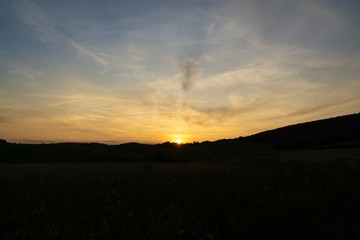Sunrise or sunset over the hills and meadow. Slovakia
