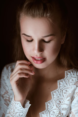 portrait of Stunning young fashionable bride holding bouquet