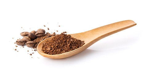 coffee powder in wood spoon on white background