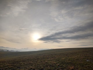 Naklejka na ściany i meble Sunrise or sunset over the hills and meadow. Slovakia 