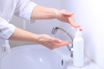 A female doctor washes her hands thoroughly.  Pandemic virus COVID-19