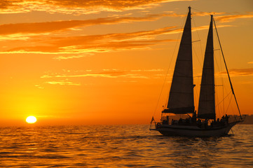 Beautiful sunset with a sailboat 
